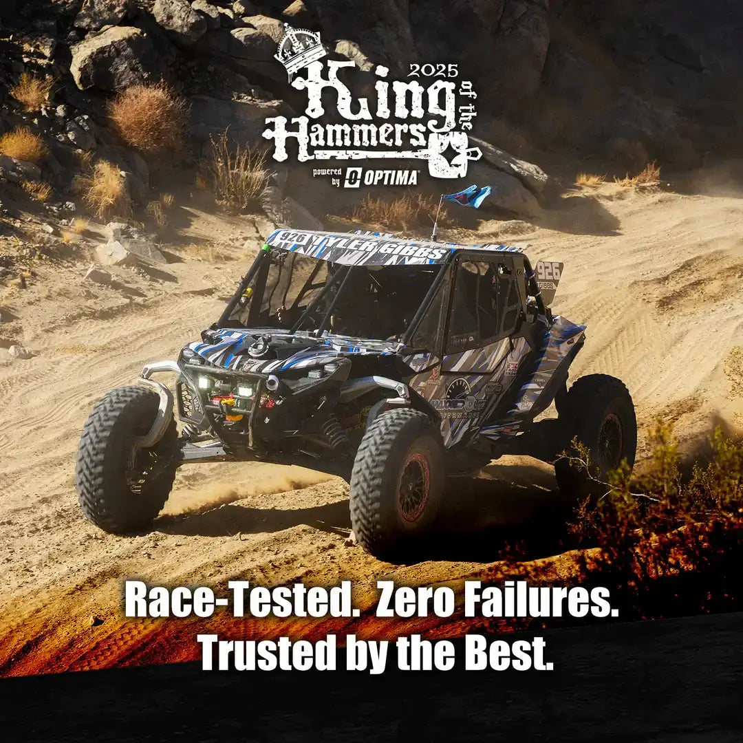 Racing vehicle on challenging terrain, showcasing performance wheels for challenging terrains in action.